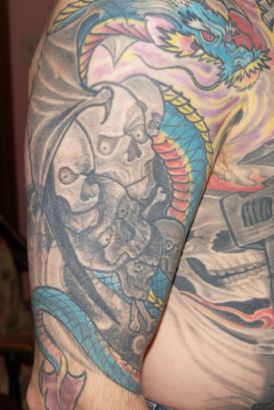 Scull And Dragon Tats On Arm